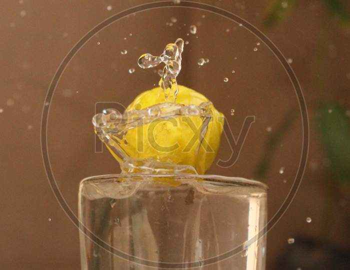splash of lemon in glass