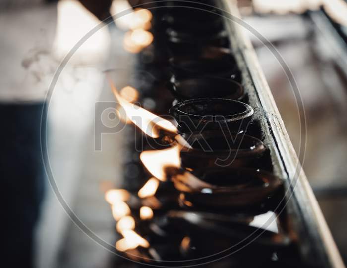 Burning Clay Oil Lamps Light Flame Close Up