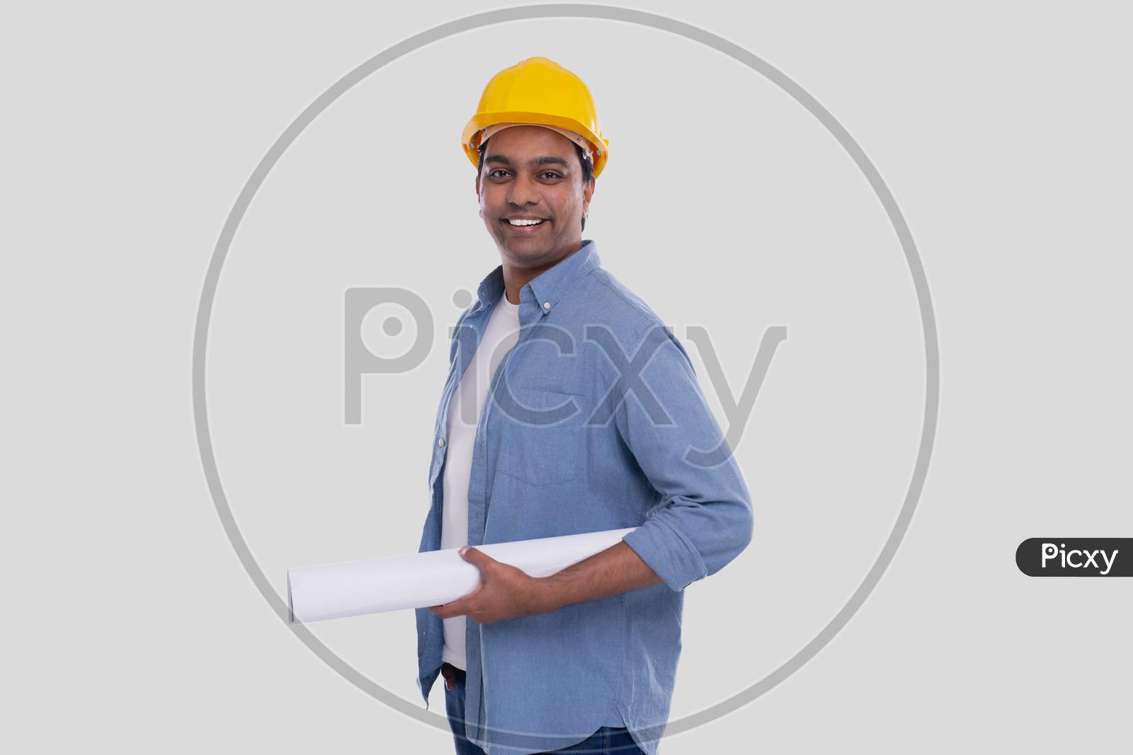 Construction Worker Holding House Plan In Hands. Architect Holding Blueprints. Yellow Hard Helmet.