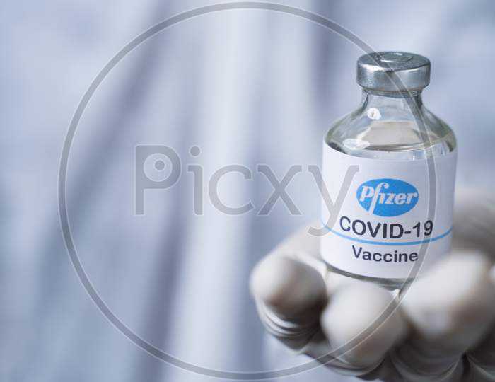 Maski, India - Nov 12,2020 : Close Up Of Doctor Hands Giving Pfizer Biontech Vaccine To Protect From Coronavirus Or Covid-19 Pandemic.