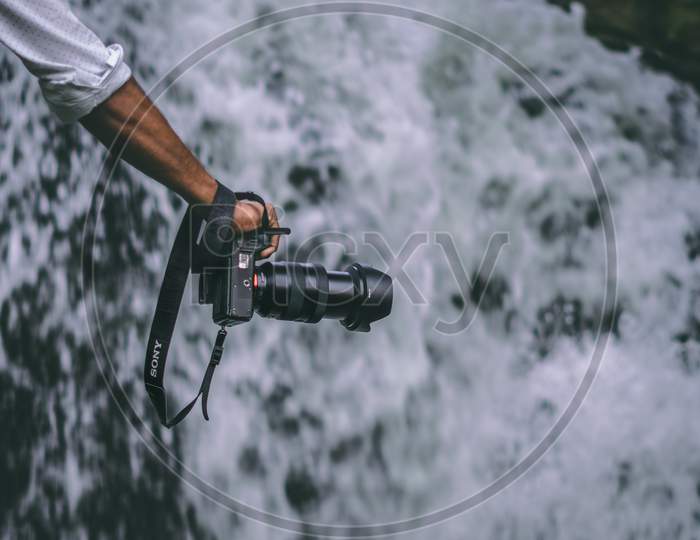 Beautiful Picture Of Sony Camera In Front Of Waterfalls