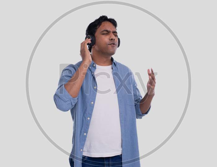 Indian Man Listening To Music. Man Listening Music. Enjoys The Melody. Man Isolated