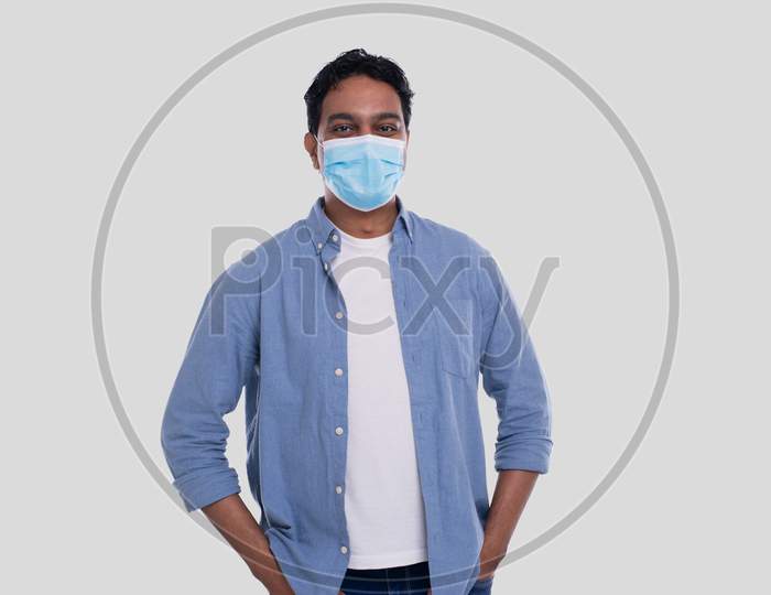 Indian Man Wearing Medical Mask Isolated. Man In Blue Shirt With Medical Mask. Health, Virus, Medical Concept
