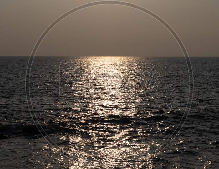 Distance Ocean Sunset Reflection On Water Landscape