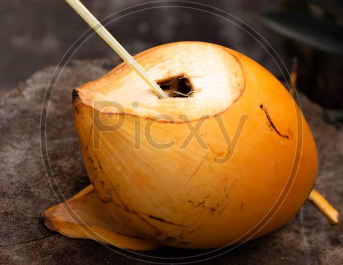 King Coconut With A Straw Inside