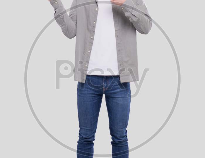 Man Showing Hand To Side And Pointing At It Smilling Isolated. Man Full Lenght Standing