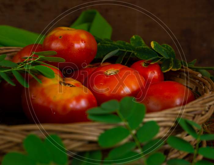 Fresh Red Tomatoes In A Basket