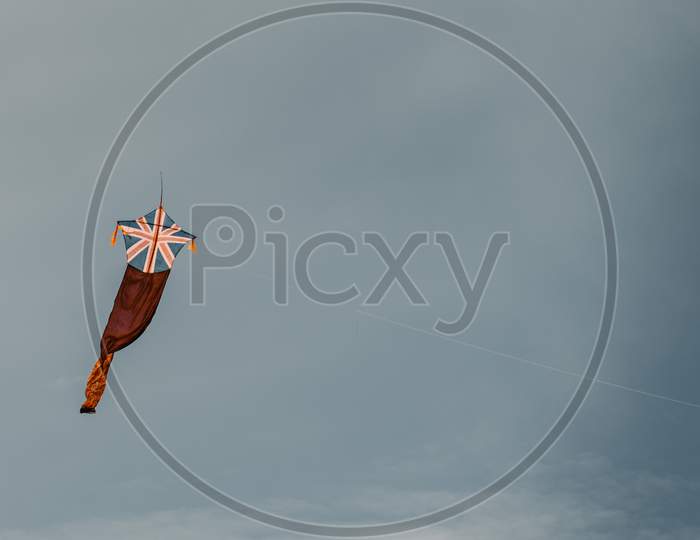 Kite Fly Against The Dark Moody Sky