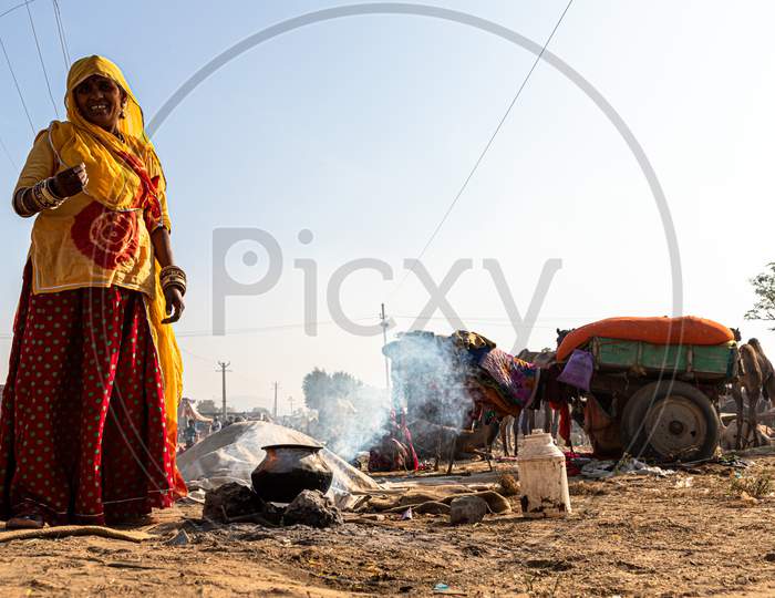 Portrait Of A Woman Making Food In Rajasthan.