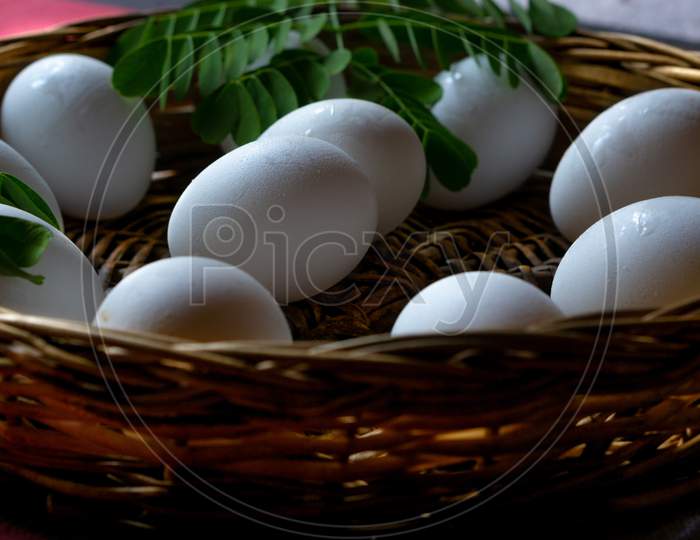 White Eggs Stacked In A Basket