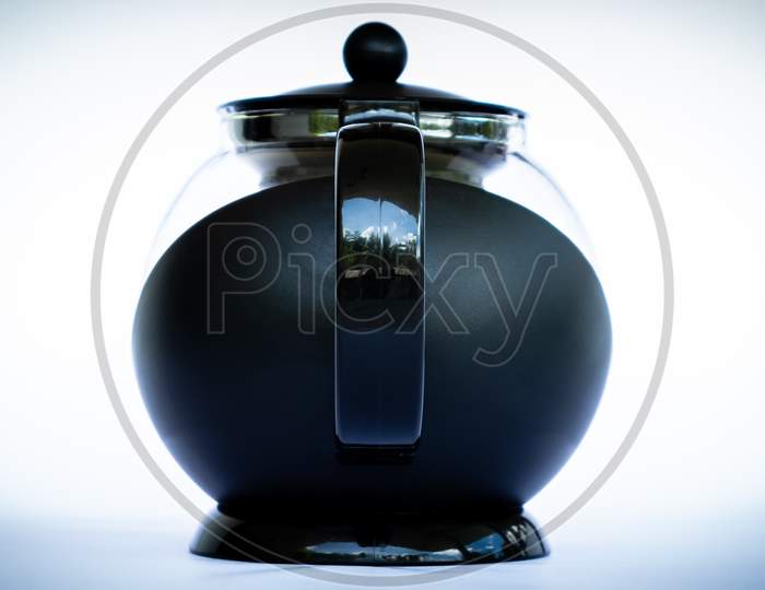 Black Glass Coffee Pot In Neutral Background Back Side View