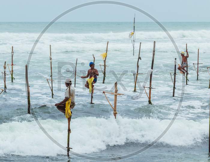 Weligama, Southern Province / Sri Lanka - 07 26 2020:Stilt Fishermen Beautiful Scenery In Southern Sri Lanka.
