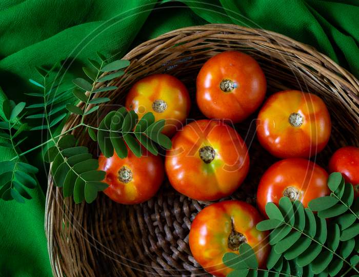 Fresh Red Tomatoes In A Basket