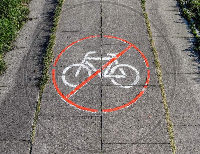 Painted Bicycle Signs On Asphalt Found In The City Streets Of Germany.