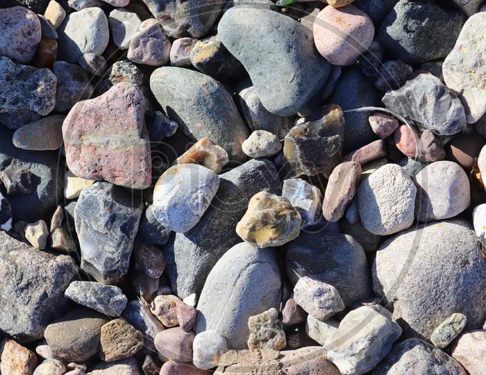 Beautiful Stone Pebbles At The Beach Of The Baltic Sea In The North Of Germany.