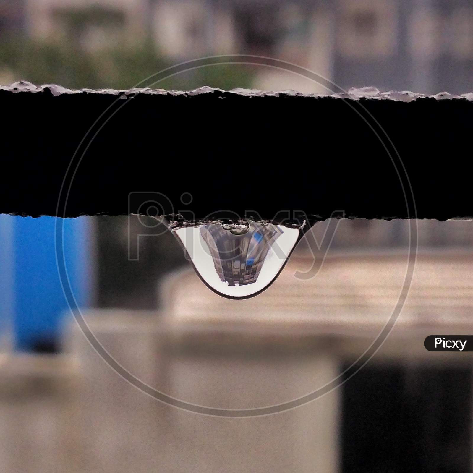 Building reflection in drop