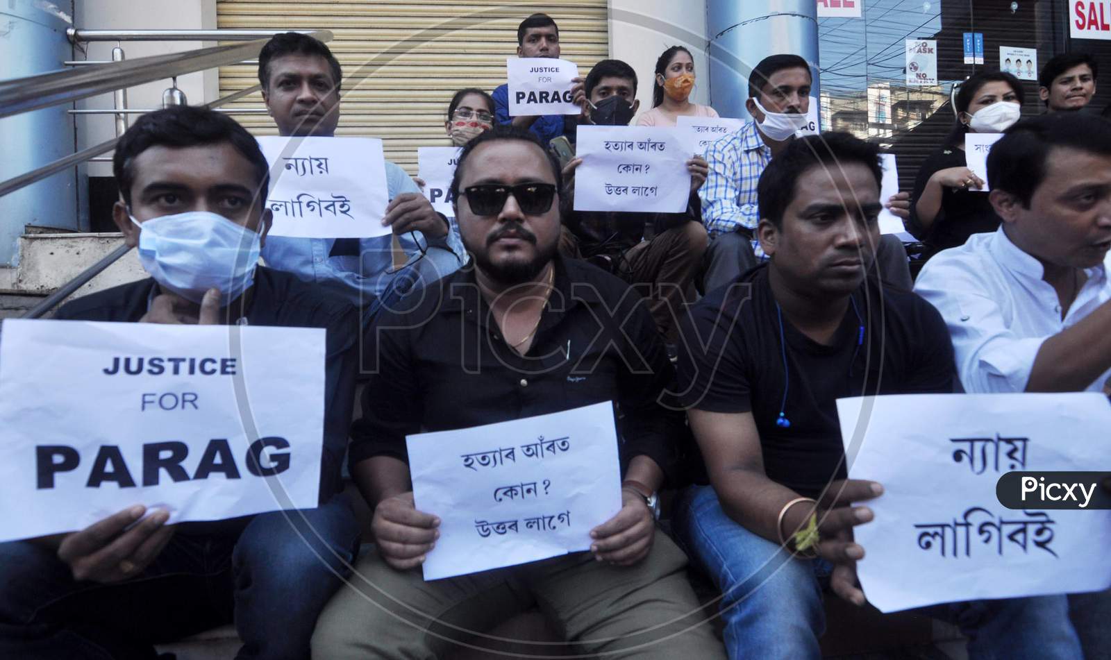 Jornalist hold playcard as  they  protest against the alleged murder of a  journalist Parag Bhuyan by unidentified miscreants, in Guwahati, Friday, Nov. 13, 2020.