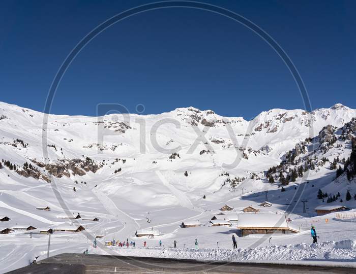 Scene Of Ski Lift And Skiing On Snow Capped Mountain In Hasliberg Meiringen, Bernese Oberland. Hasliberg, 05 February 2019.