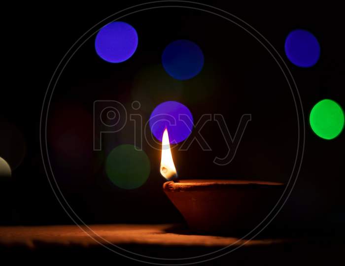 Clay Lamp Lit During Diwali With A Beautiful Bokeh Background.