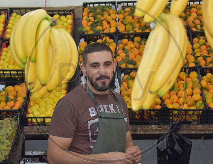 man selling fruits in market