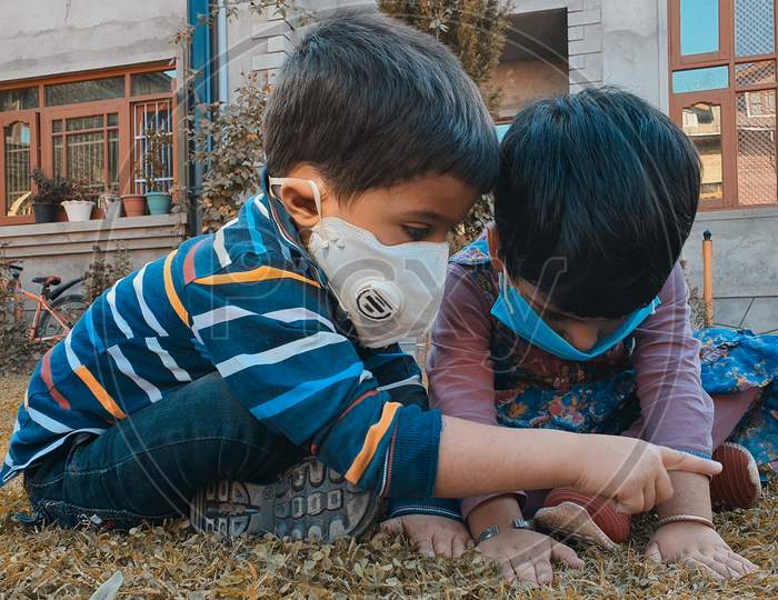 Kids Play Wearing Mask After The Coronavirus Lockdown In Asian Countries.