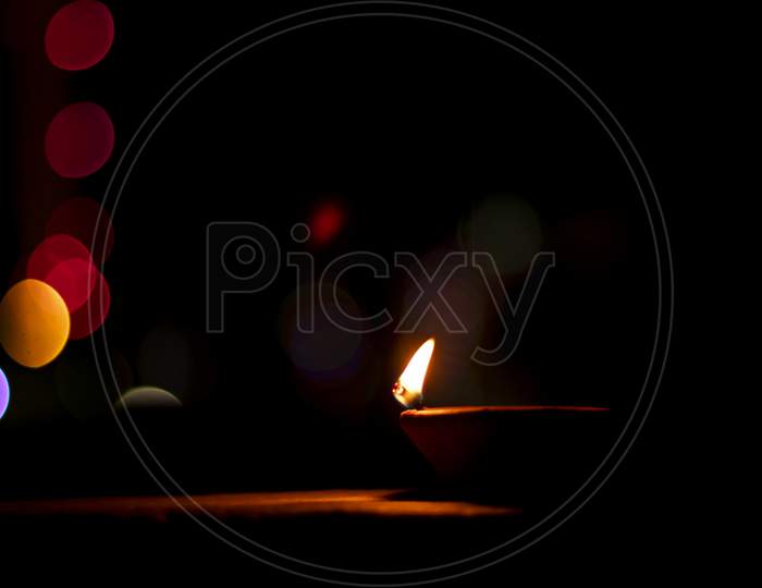 Traditional Clay Diya Lamps Lit During Diwali Celebration