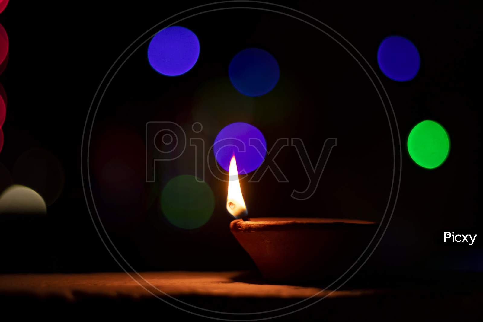 Clay Lamp Lit During Diwali With A Beautiful Bokeh Background.
