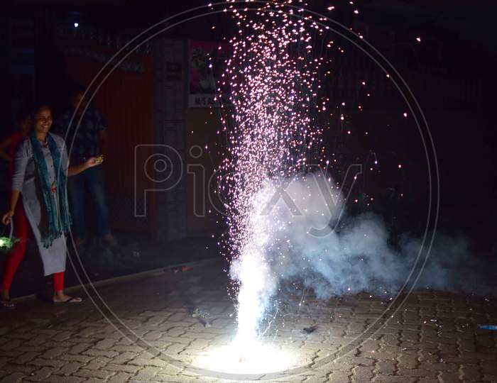 People burst firecrackers on the occasion of Diwali  in Nagaon District of Assam on Nov 14,2020.