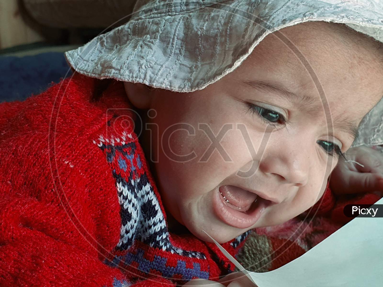 New Born Child Under Blanket At Home Asian Color Looks Very Beautiful.