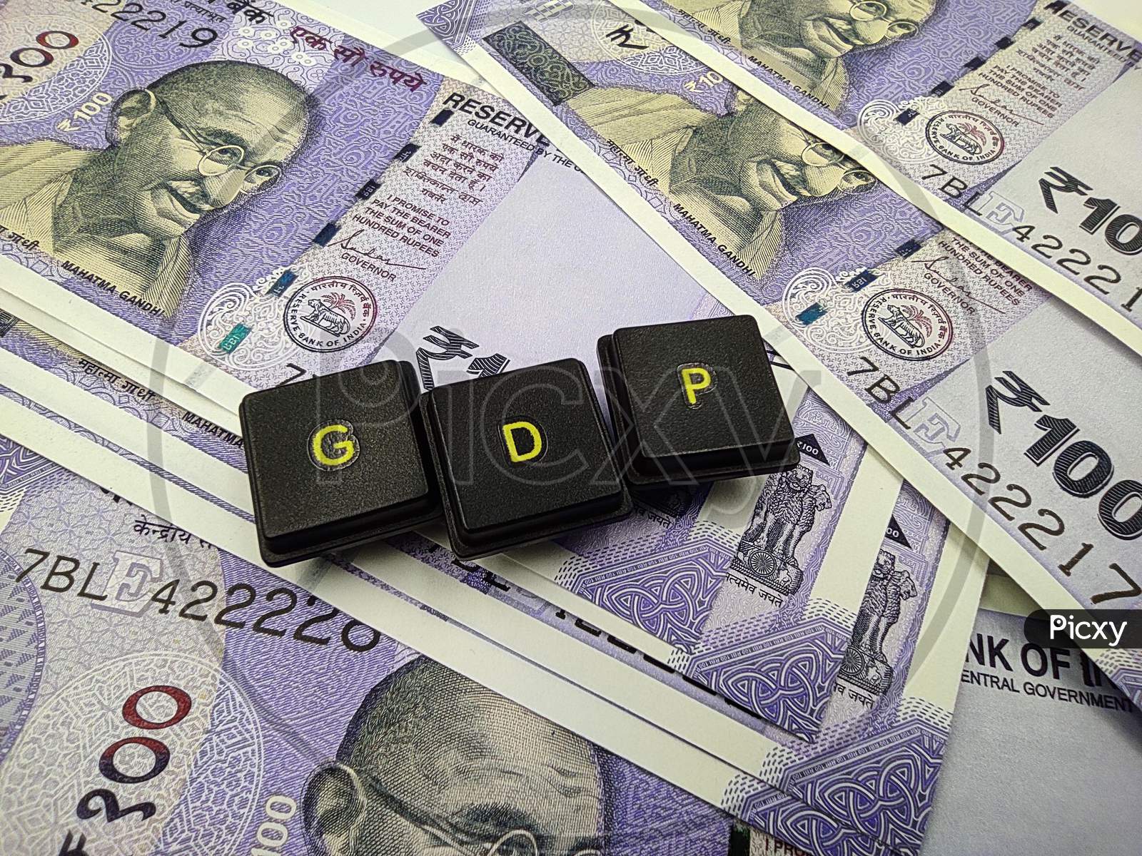 indian currency and gdp word spelled out