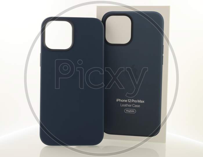 Frankfurt, Germany - November 13th 2020: A german photographer bought the new iPhone 12 Pro Max with MagSafe accessories as the iPhone case and the magnetic wallet, taking pictures of the unboxing.