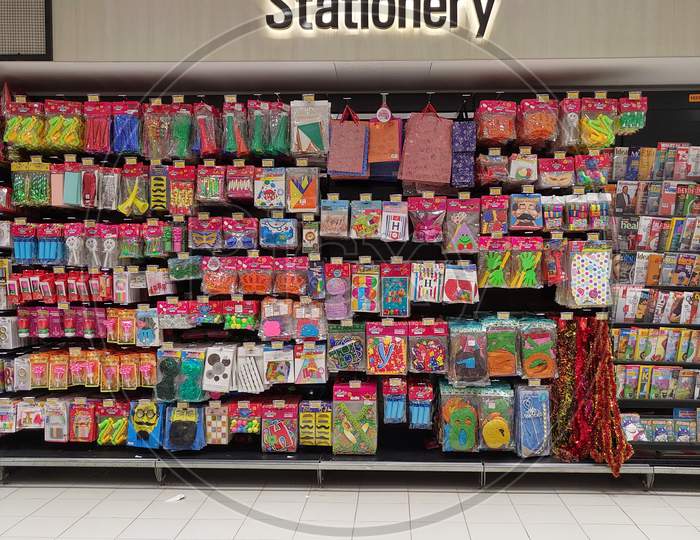 Shelf with stationery in a supermarket .Shelf with stationery in a supermarket .: Display of stationery, pen, pencil, ruler and other items