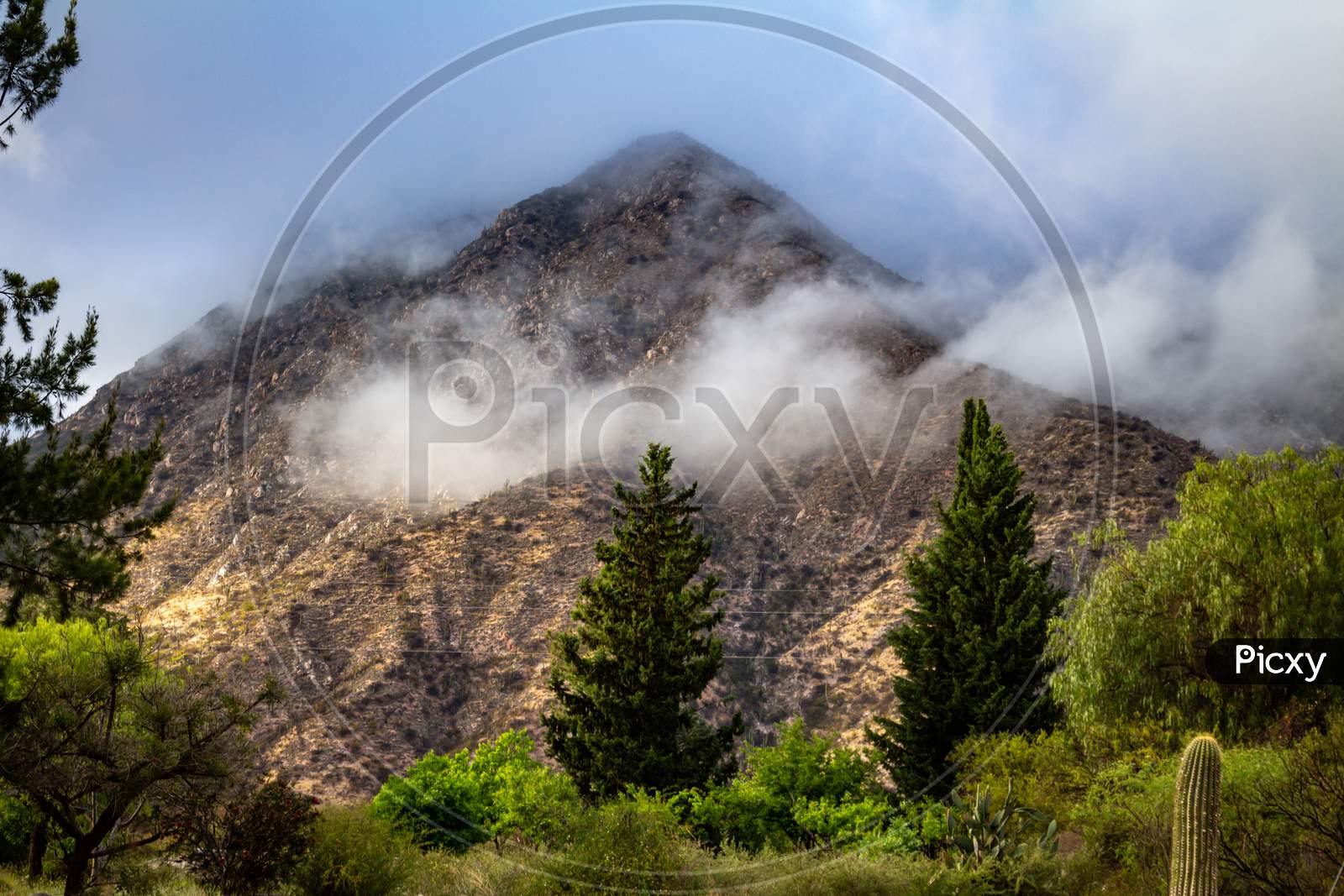 Beautiful Mountain In The North Of The Argentine Republic Covered By Clouds. Subtropical Mountainous Landscape.