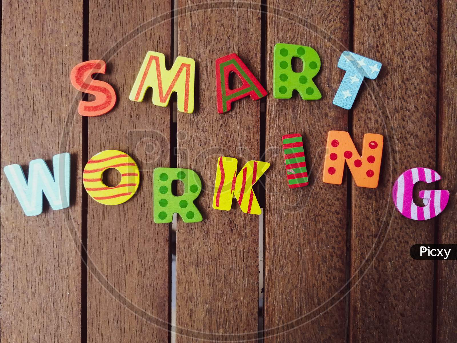 smart working letters on wood background