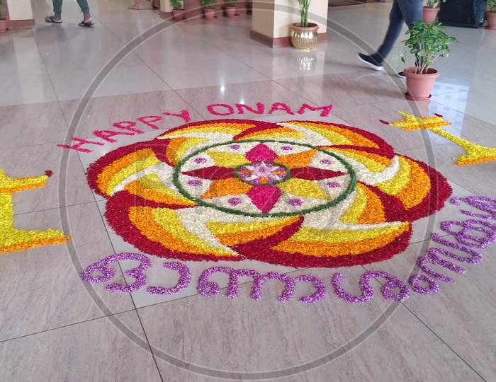onam celebration.  Festivals of Kerala: Onam. Floral decoration, flower carpet design (athappookkalam, rangoli), during Onam celebrations. Kerala tourism. Top down view of a floral carpet. Incredible India.