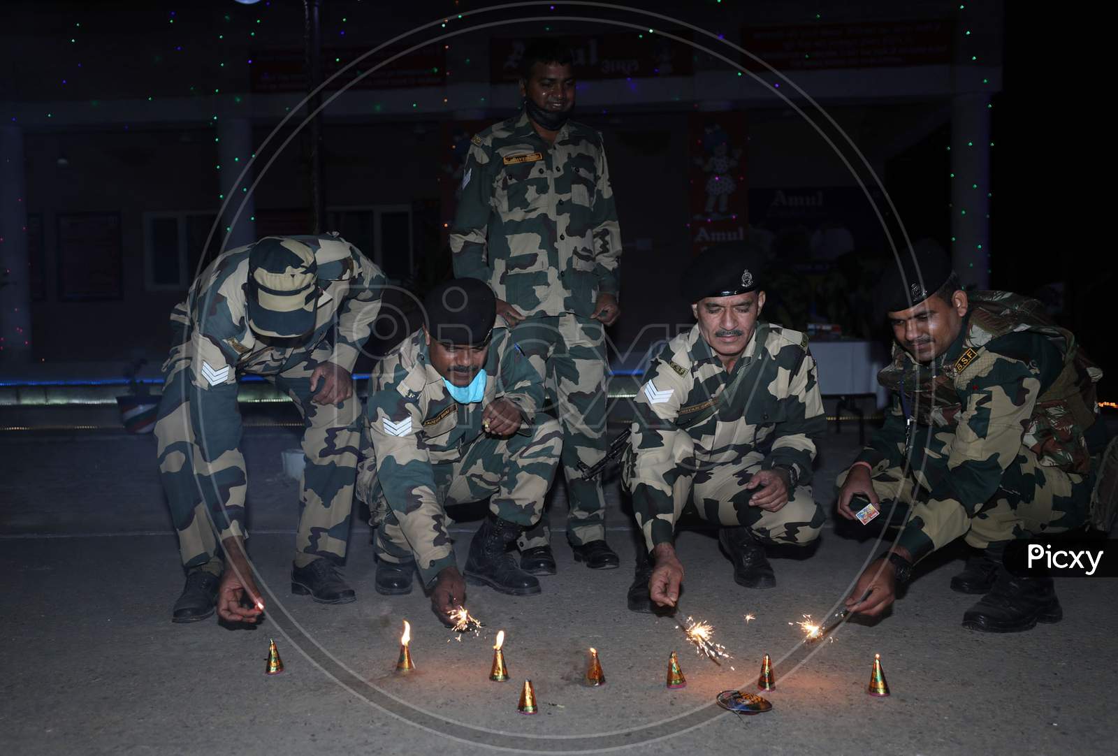 Border security force (BSF) soldiers placing candles near the fence as they celebrating Diwali festival at International border outskirts in Jammu  ,14 November,2020.