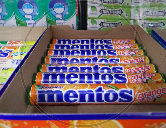 A close up view of rows of Mentos candy on a shelf at one of the retail outlets,
