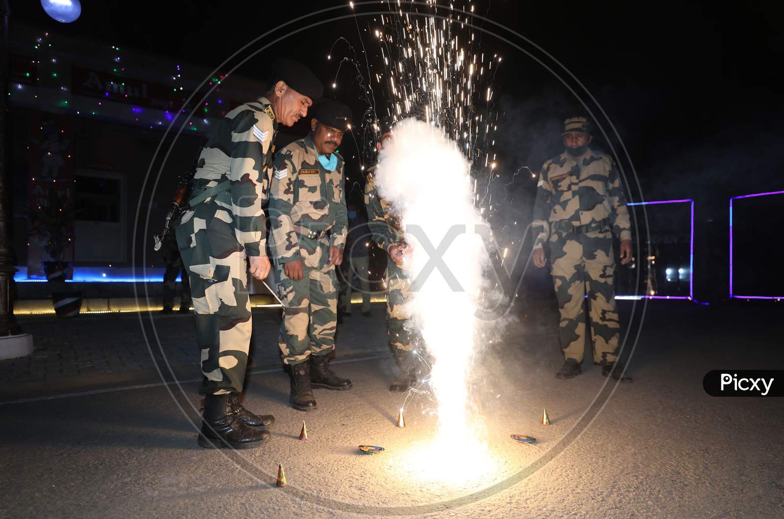Border security force (BSF) soldiers enjoying crackers as they celebrating Diwali festival at International border outskirts in Jammu  ,14 November,2020.