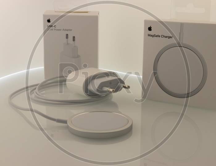 Frankfurt, Germany - November 13th 2020: A german photographer bought the new iPhone 12 Pro Max with MagSafe accessories as the charger, taking pictures of the unboxing.