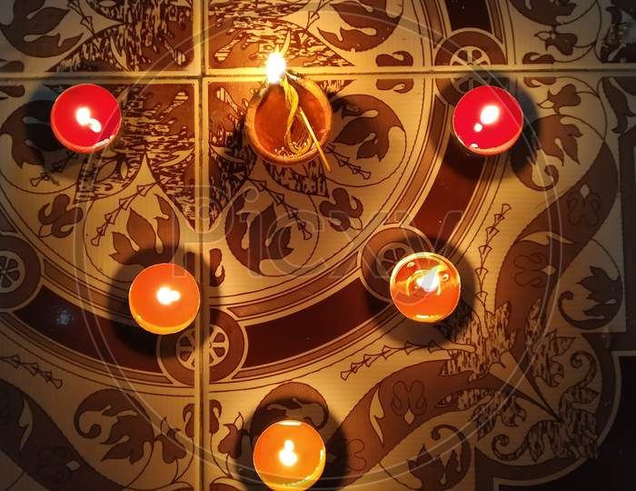 Diya Lighten-Up In Diwali Designed In A Beautiful Shape In Floor