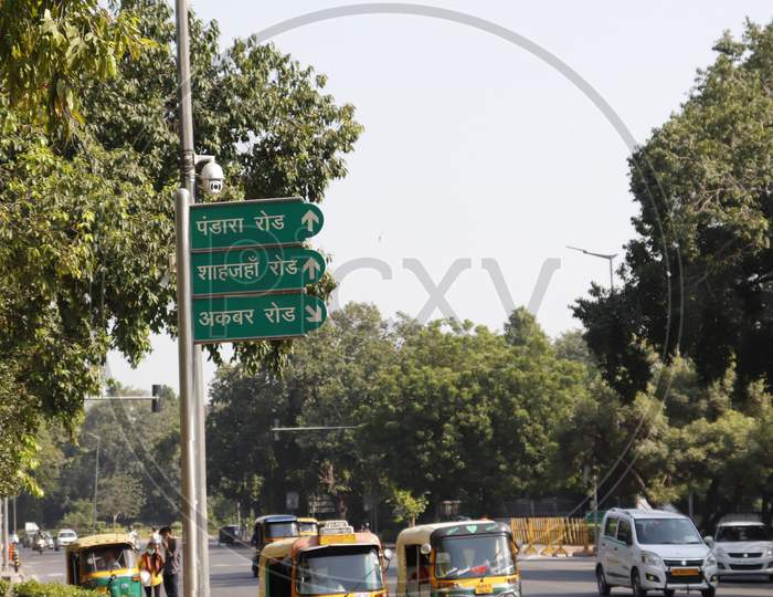 India Gate, 2 oct. New Delhi, India, 2020. Blue board of outer circle Akbar Road & green street sign for shah jahan road written in English.