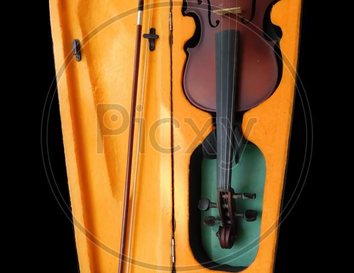 Musical Instrument (Violin)With Its Box Isolated On Black Background