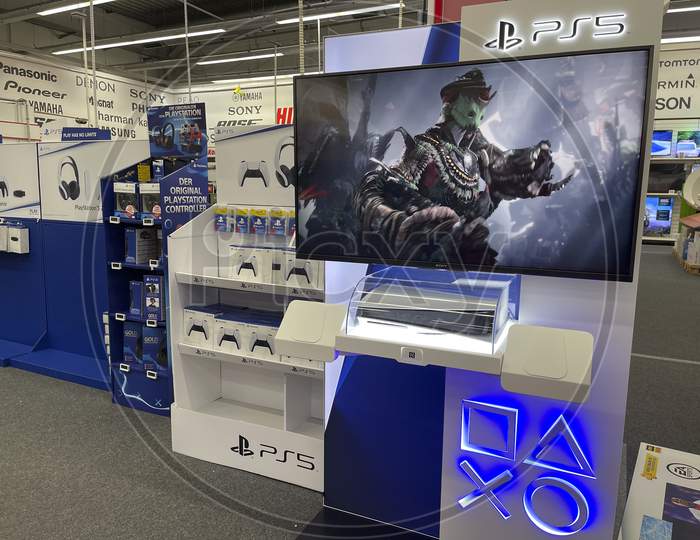 Frankfurt, Germany - 14th November 2020: A german photographer looking for the new Playstation 5 (PS 5) in a Saturn market, taking pictures of the displayed console, which is not on sale at this time.