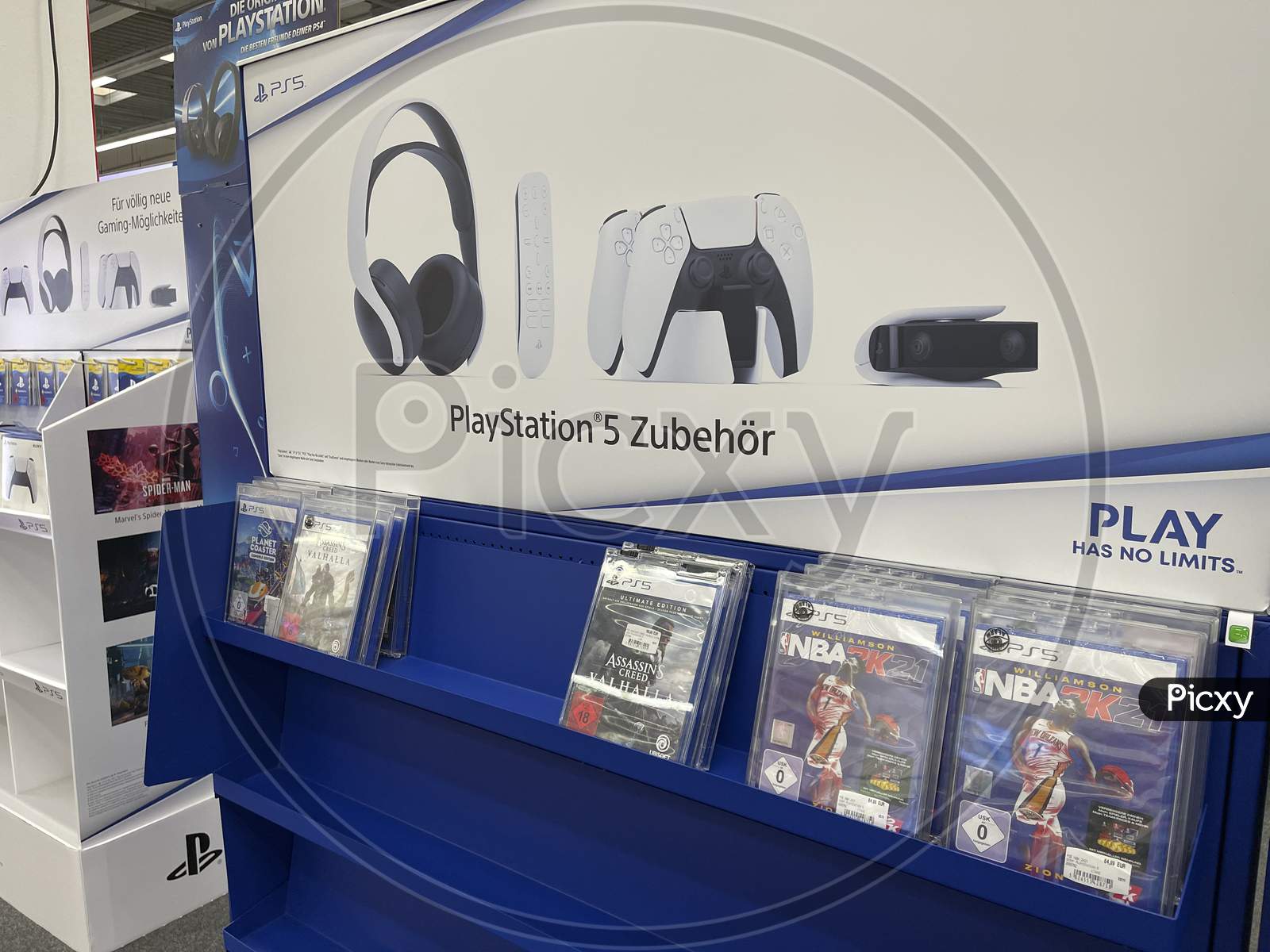 Frankfurt, Germany - 14th November 2020: A german photographer looking for the new Playstation 5 (PS 5) in a Saturn market, taking pictures of the first available games for the console.