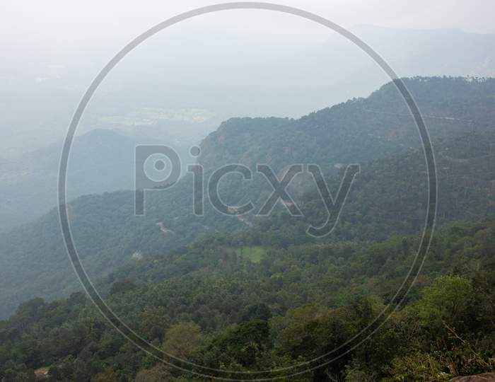 Scenic View Of The Foggy Landscape With Winding Ghat Road On The Way To Yercaud, Salem, India.