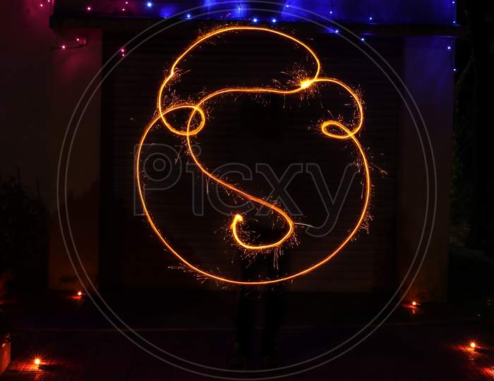 Light painting of lord ganesha on diwali made with sparkle
