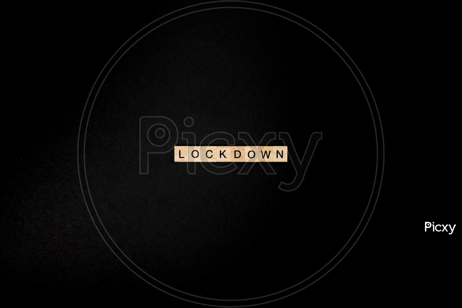 Wooden Letters On A Black Background Forming The Word “Lockdown”. Second Wave During Coronavirus Pandemic Concept.