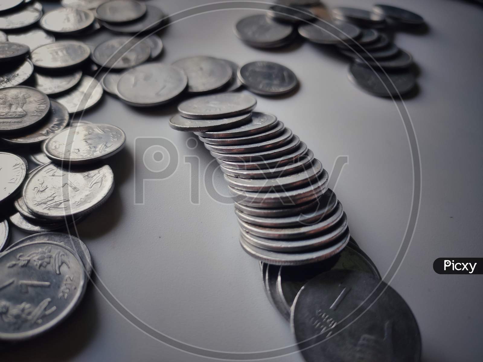 this is a picture of coins on white background.this is a collection of old coins.