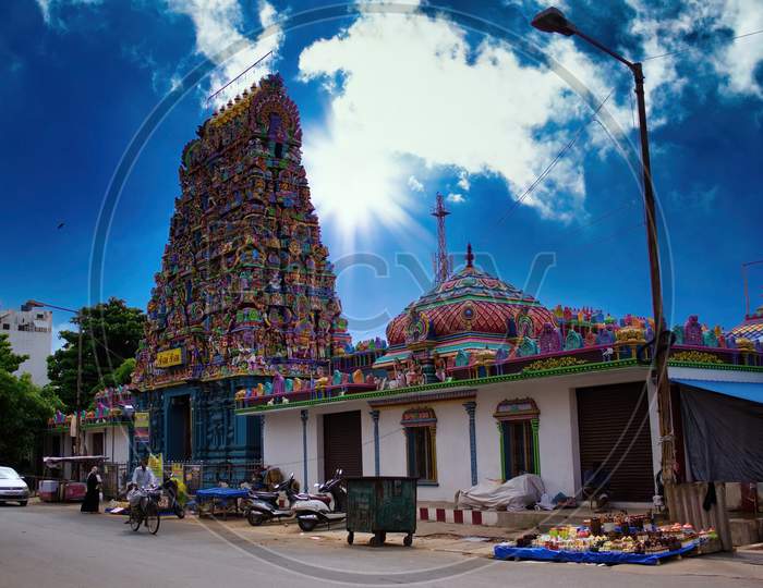 Pondicherry, India - October 30, 2018: Wide Angle Shot Of An Indian Colorful Temple Named Vedapureeswarar Exterior Displaying Beautiful Hindu Architecture With Gods Sculpture Carved On It'S Built.