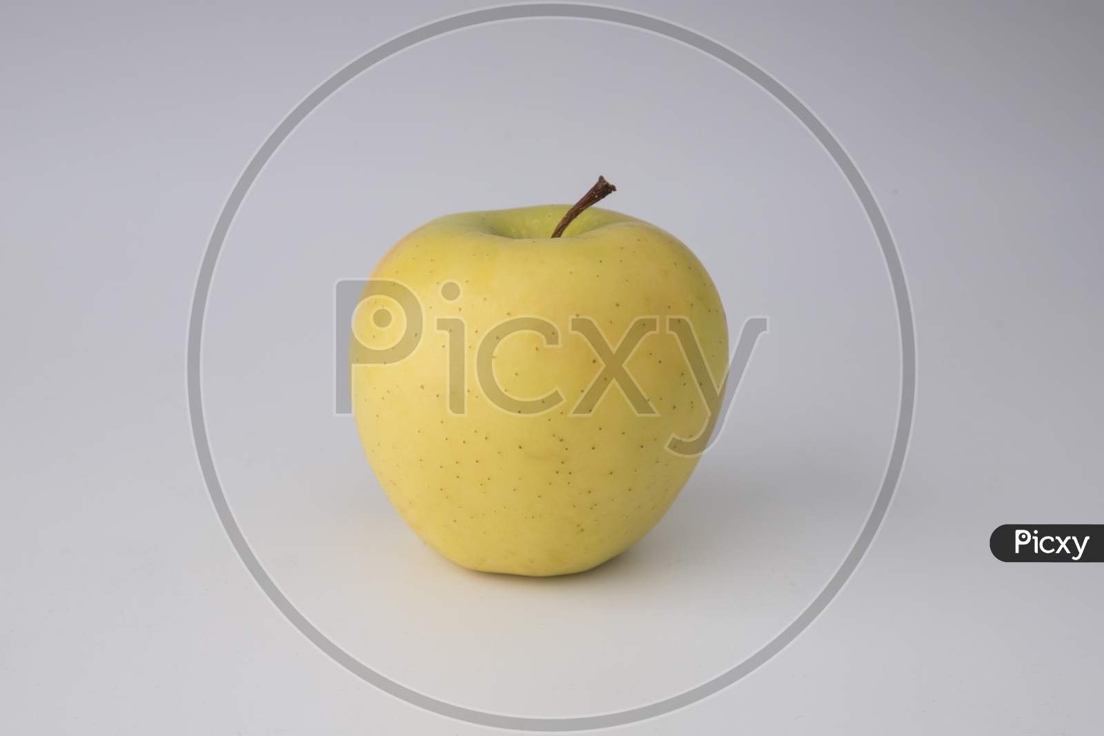 yellow apple in white background